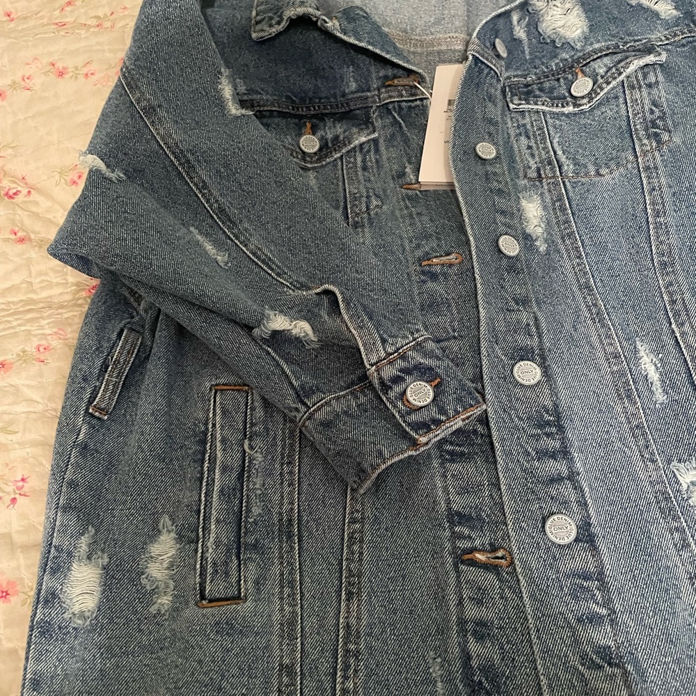 Distressed denim jacket